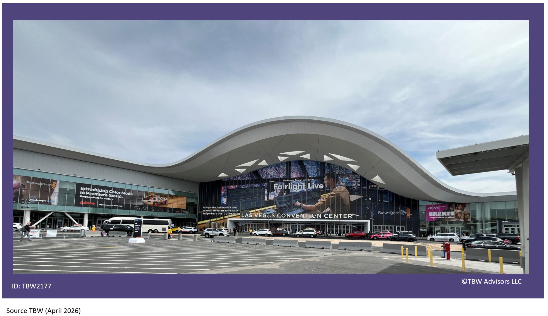 Front of LVCC Central Hall with all teh adds decorating the windows and a NAB Create sign, cabs and ride shares out in front.