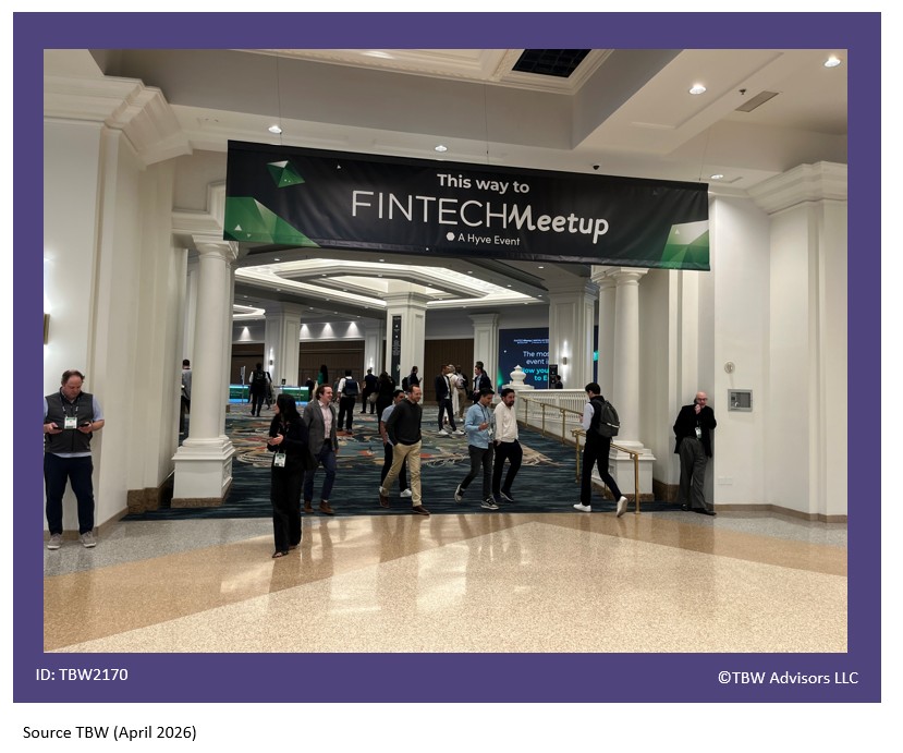 Picture of the This Way to FINTECH Meetup with Mandalay bay beautiful white columns on the left and right with attendees under the sign and the marble floors in the foreground.